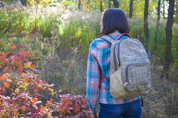 The girl with the backpack. - 写真・画像