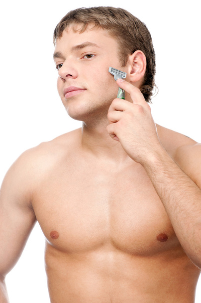 Portrait of a young handsome man shaving - Fotografie, Obrázek