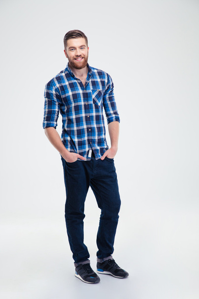 Full length portrait of a smiling casual man - Photo, image