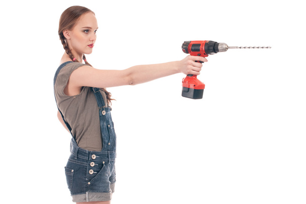 Young woman holding drill with auger - Foto, immagini