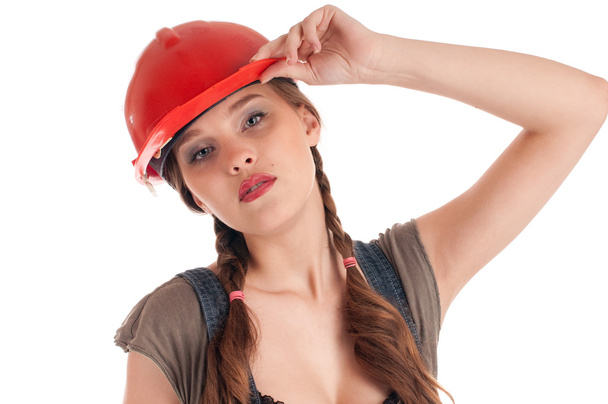 Young playful worker woman in coverall and helmet - Foto, Bild