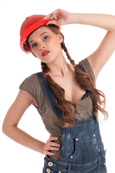 Young playful worker woman in coverall and helmet - Fotoğraf, Görsel