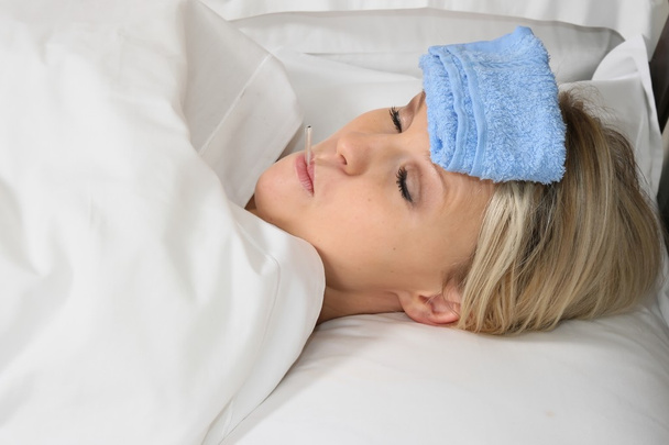 Sick Blond Woman in Bed - Fotó, kép