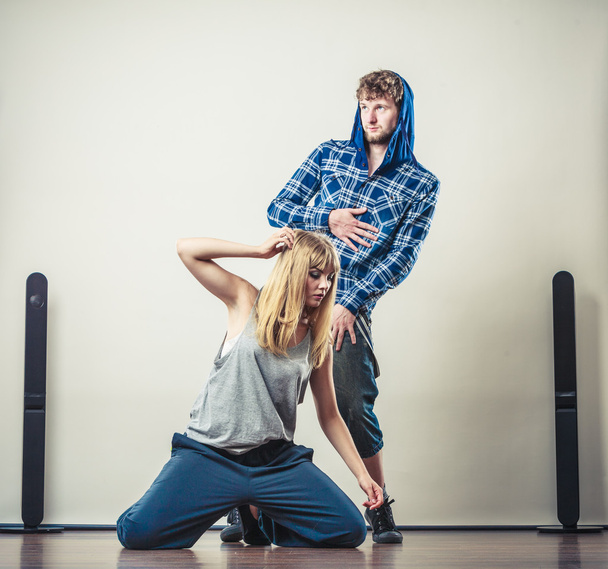 couple of young man and woman dancing hip-hop - Photo, Image