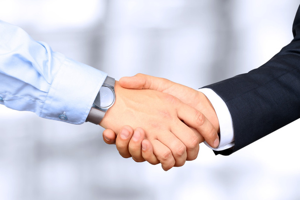 Close-up image of a firm handshake  between two colleagues - Photo, Image