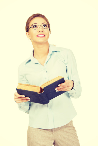 Businesswoman holding a book. - Foto, imagen