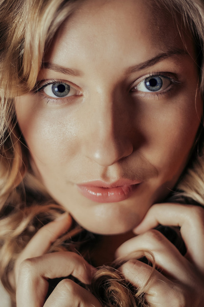 Close-up portrait of beautiful model on black background - Фото, изображение