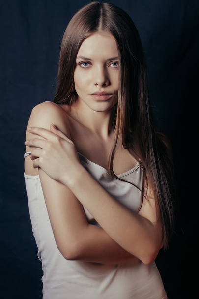 Close-up portrait of beautiful model on black background - Фото, зображення