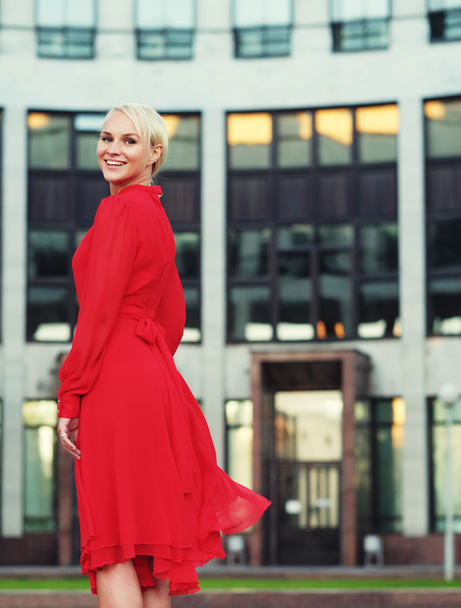 Happy beautiful woman in red summer dress - Fotografie, Obrázek