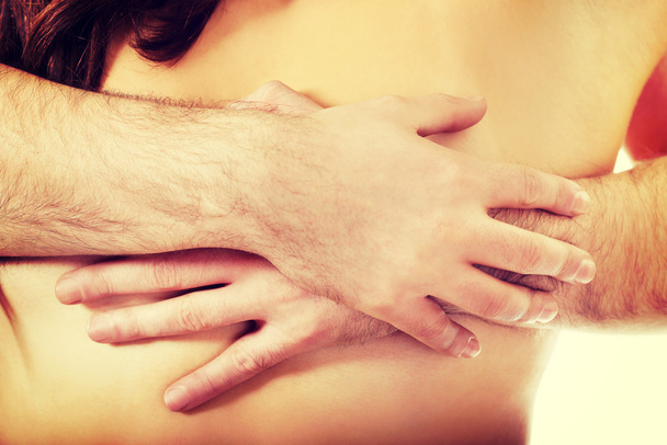 Man touching woman's breast. - Valokuva, kuva