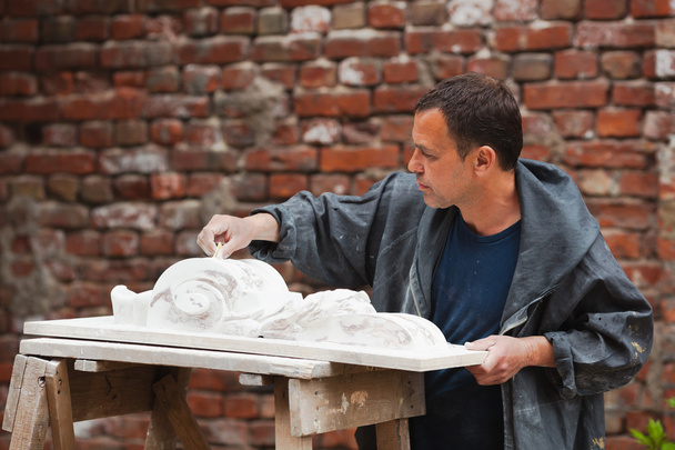 craftsman restorer working with gypsum model - Photo, Image
