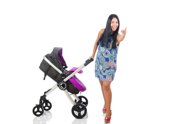gelukkig mam met haar baby in kinderwagen - Foto, afbeelding