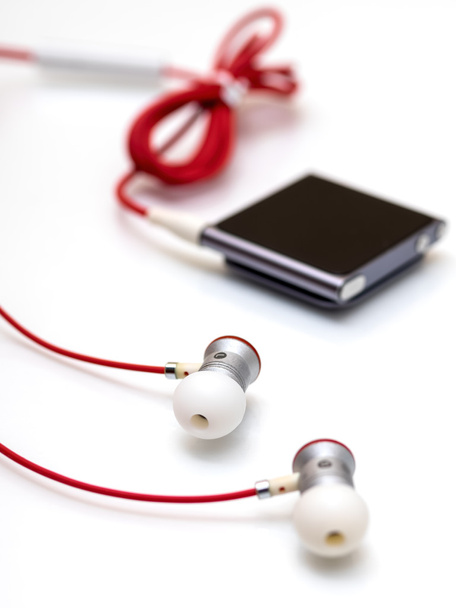 Earphones and mp3 player - Photo, Image