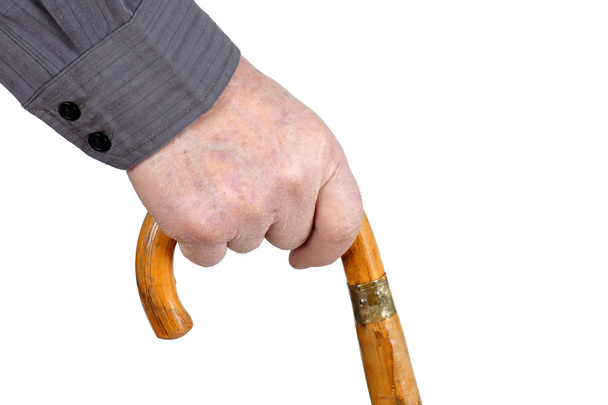 Senior's hand walking with cane - Foto, imagen