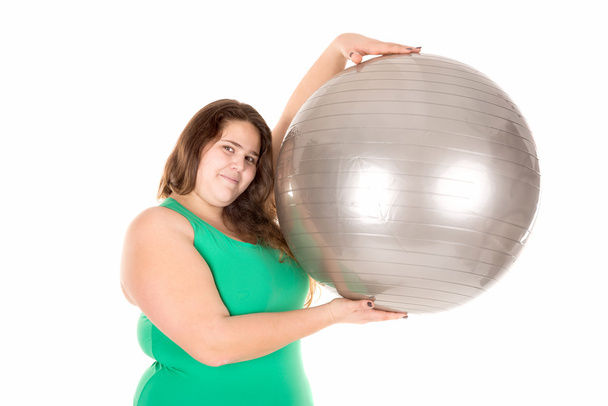 Большая девочка с мячом для упражнений
 - Фото, изображение