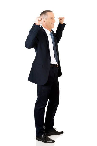 Successful businessman with arms up - Foto, afbeelding