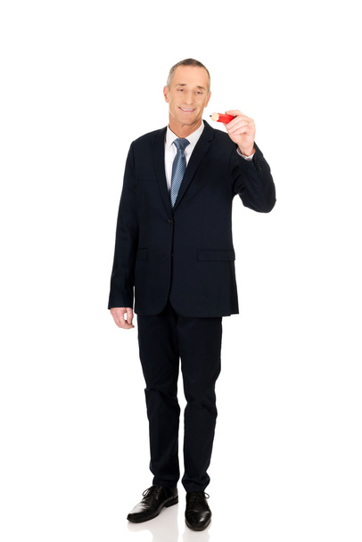Businessman with big red pencil - Фото, изображение