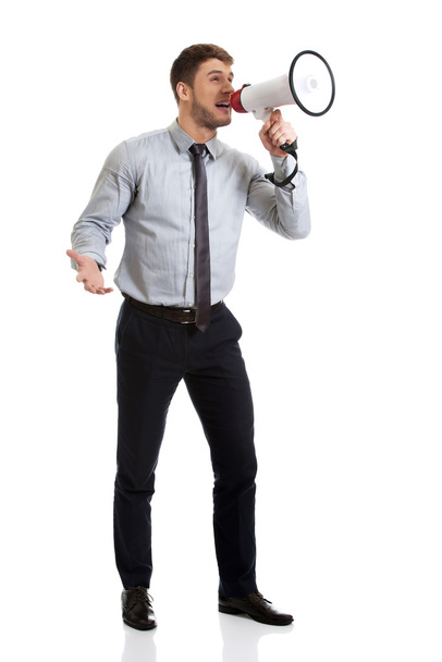Businessman shouting through megaphone. - Фото, зображення