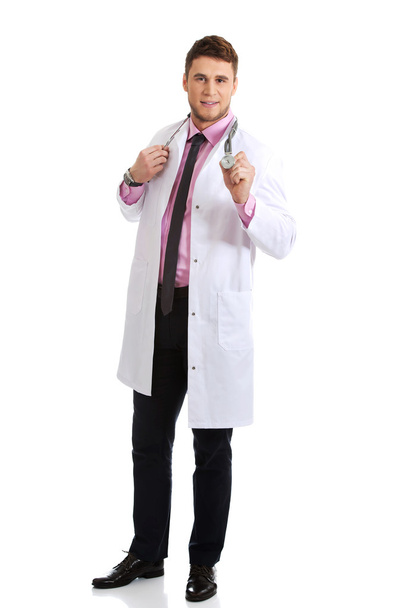 Young happy male doctor with stethoscope. - Foto, Bild