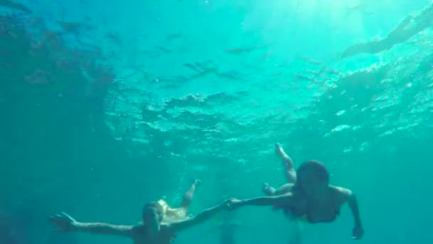 Beautiful Young Women Swim Underwater in Bikinis. Luxury Resort Vacation. Summer Fun Lifestyle. - Záběry, video