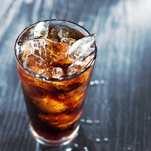 Glass of cola with ice with copyspace in composition - Fotó, kép