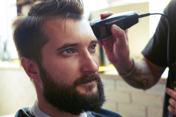 barber cutting hair - Fotó, kép