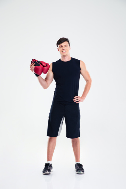 Fitness man holding boing gloves - Foto, immagini