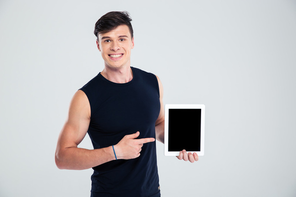 Man pointing finger on blank tablet computer screen - Foto, imagen