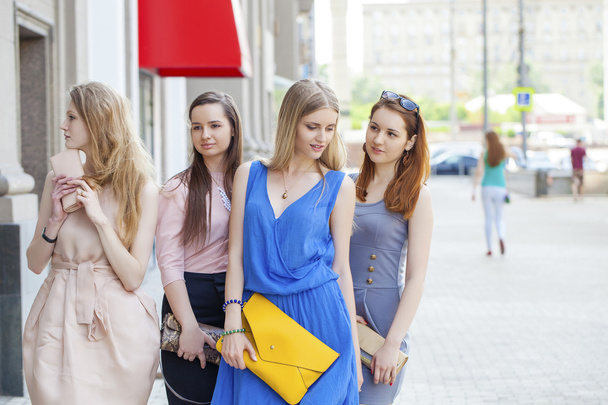 Portrait of a beautiful young four women walk on summer city - Foto, Imagem