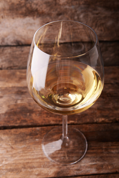 Glass of white wine on wooden table - Photo, Image