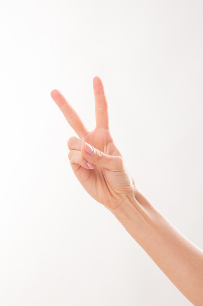 Woman showing two fingers - Foto, Imagen