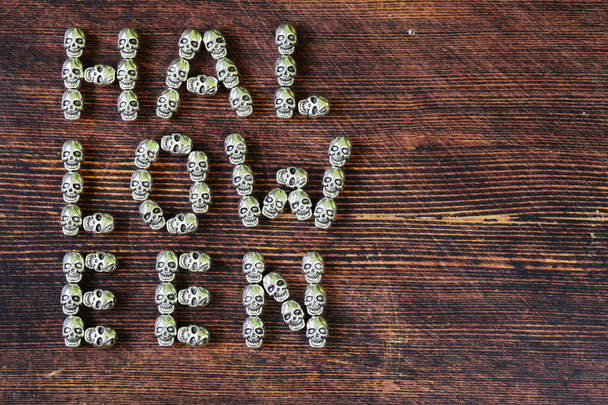 set alphabet of letters from metal skulls - word Halloween - Фото, изображение