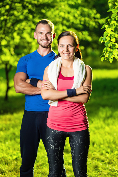 Athletic man and woman after fitness exercise - Foto, Bild