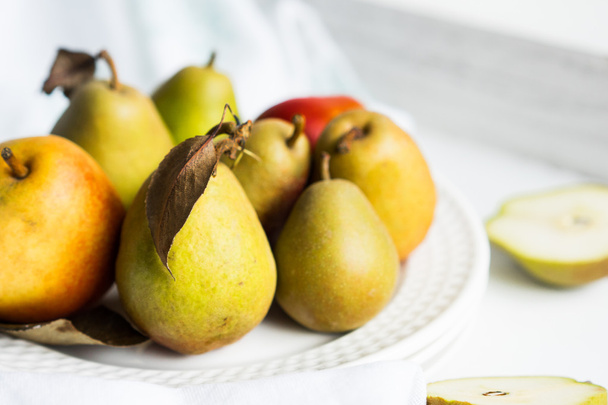 Autumn pears on white pastel background - Фото, зображення
