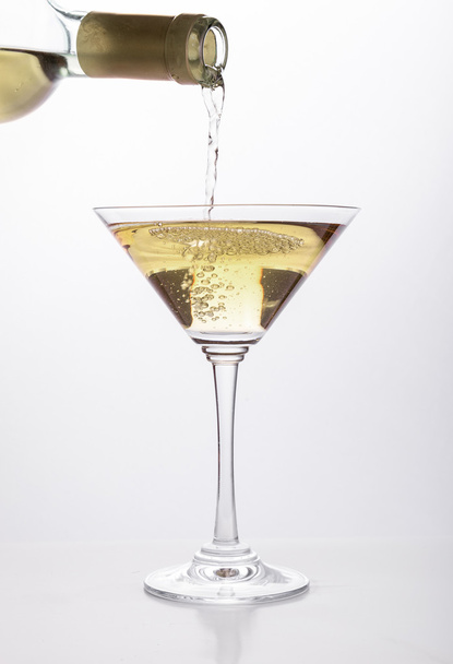 White wine pouring in a glass - Photo, image