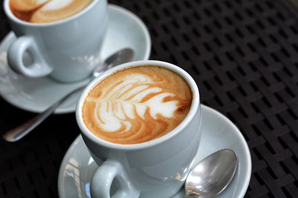 White Cup Of Foamy Cappuccino On A Black Background - Foto, Bild