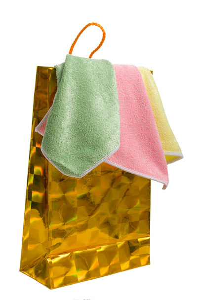 Gold paper-bag and towels. - Φωτογραφία, εικόνα