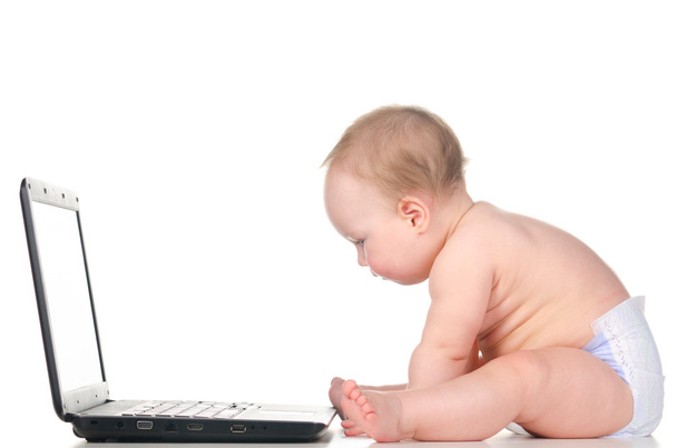 Baby is working on laptop - Photo, image