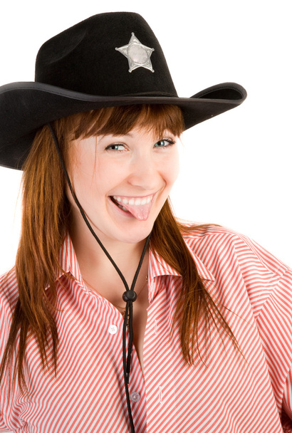 Red haired cowgirl in hat grimacing - Fotografie, Obrázek