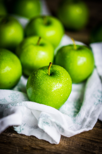 Bright green apples on wooden background - Фото, зображення