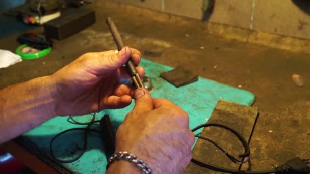 Garage workshop. Hands close up doing the repair work. - Footage, Video