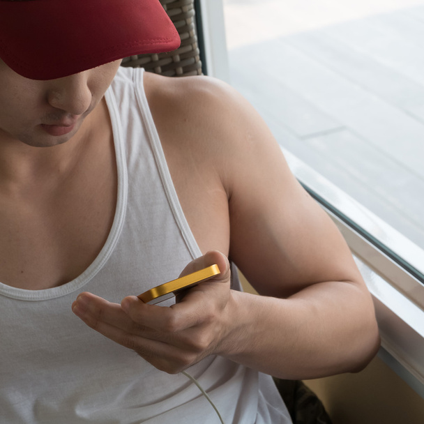 young man using a mobile phone with texting message - Fotoğraf, Görsel