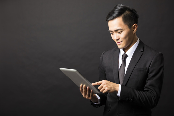 smiling young business man with tablet pc - Photo, Image