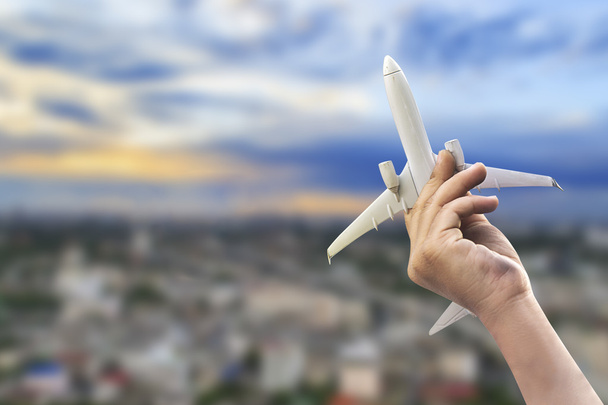 Hand of little boy holding airplane model - Photo, Image