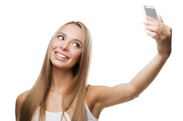 όμορφη γυναίκα να κάνει selfie σε άσπρο φόντο - Φωτογραφία, εικόνα