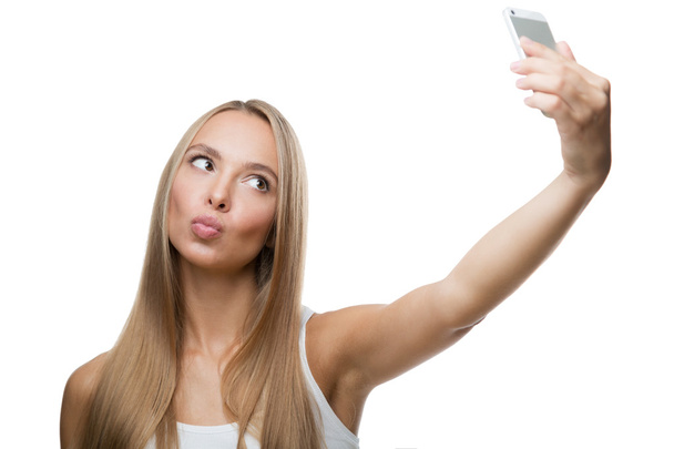 hermosa mujer hacer selfie sobre fondo blanco - Foto, Imagen