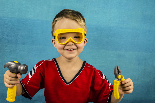 boy plays construction tools - Фото, зображення