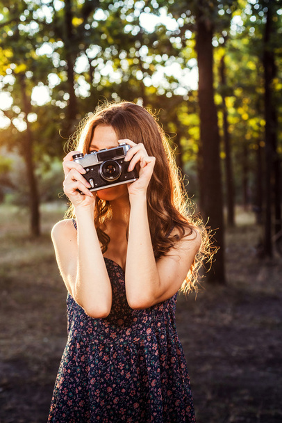 young caucasian female with vintage camera in park - Foto, Imagem