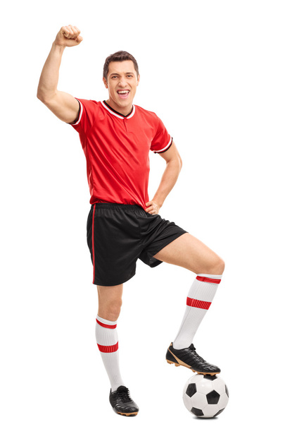 Joyful football player gesturing happiness - Foto, afbeelding