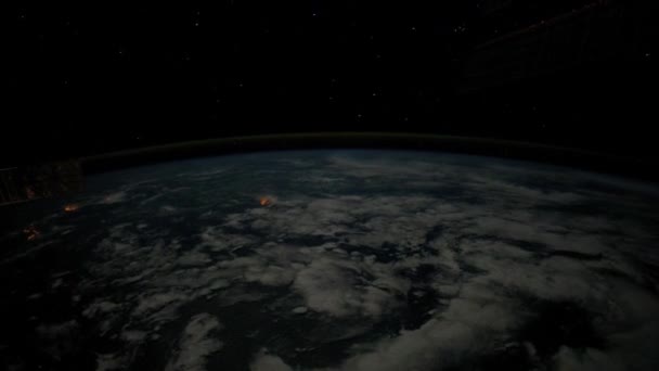 The Space Station flies over the earth - Materiał filmowy, wideo
